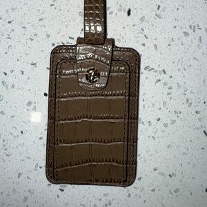 Henri Bendel brown luggage tag